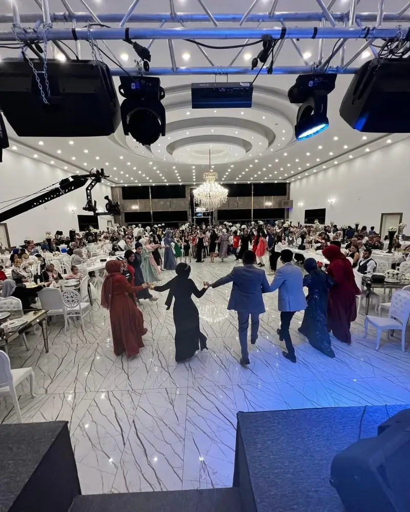 A large event in the Gala Hall, with guests dancing