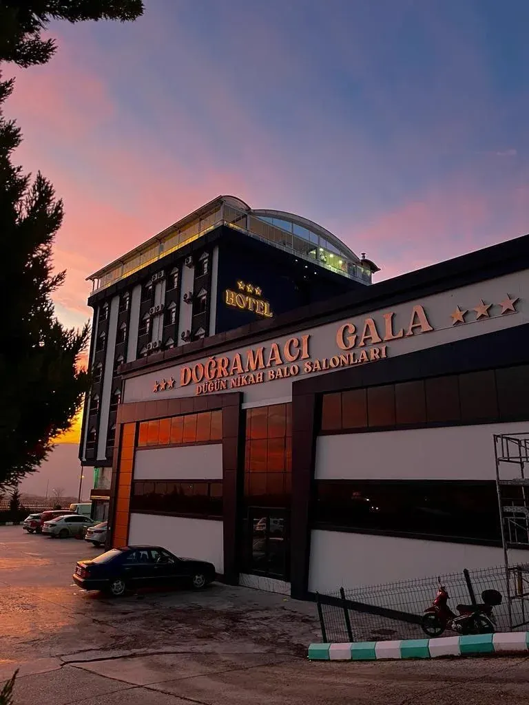 Exterior of the Doğramacı Hotel building in the evening light