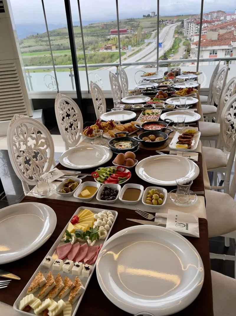 Breakfast table by the window with a view over the town